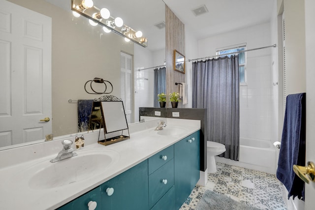 full bathroom featuring vanity, shower / tub combo with curtain, toilet, and tile patterned floors