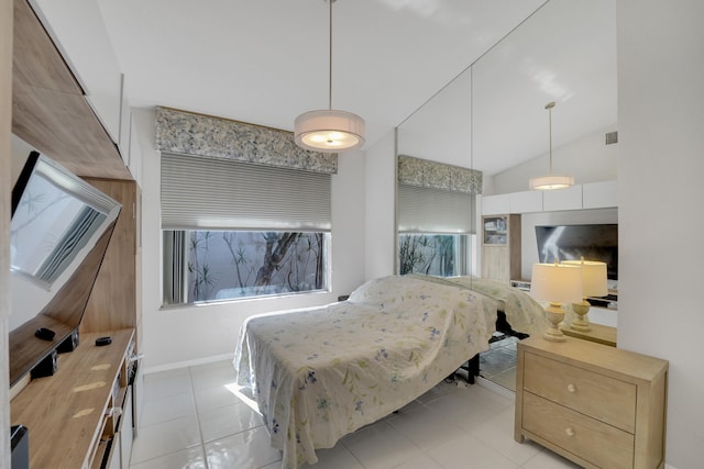 tiled bedroom with lofted ceiling