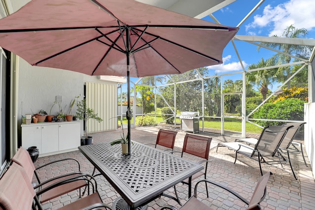 view of patio featuring a lanai and a grill