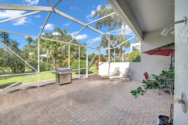 view of patio featuring area for grilling and a lanai