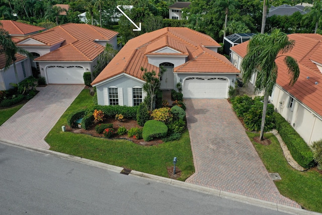 view of front of home featuring a front yard and a garage