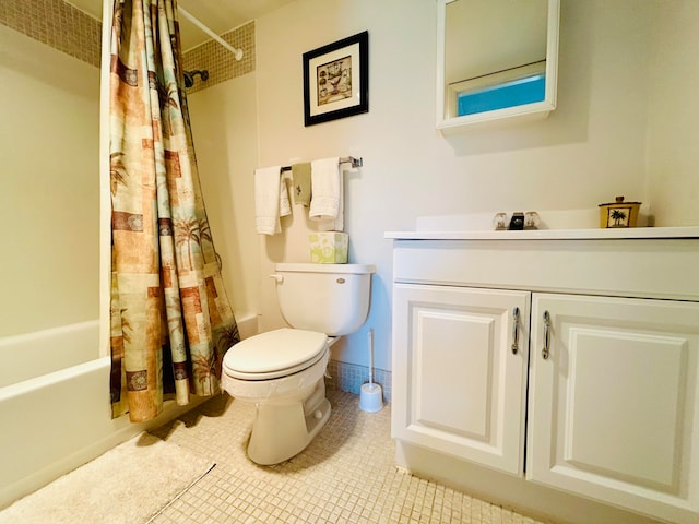 full bathroom featuring vanity, toilet, tile patterned floors, and shower / bath combo with shower curtain