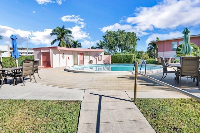 view of swimming pool with a patio area