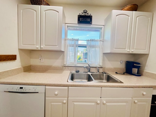 kitchen featuring dishwasher and white cabinets