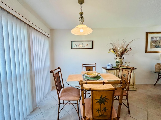 dining space featuring light tile patterned floors