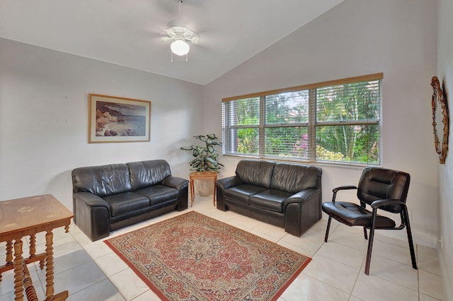 tiled living room featuring ceiling fan and lofted ceiling