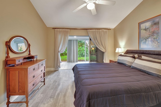 bedroom with ceiling fan, light wood-type flooring, and vaulted ceiling