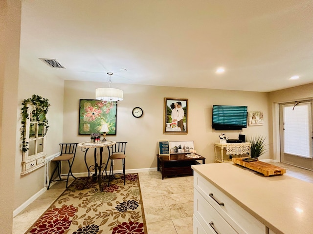 interior space featuring a notable chandelier