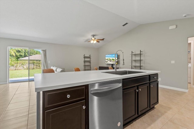 kitchen with dishwasher, sink, vaulted ceiling, light tile patterned floors, and ceiling fan