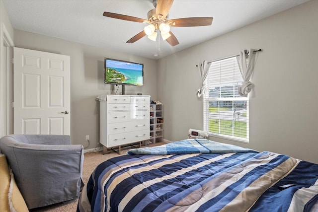 bedroom featuring light carpet and ceiling fan