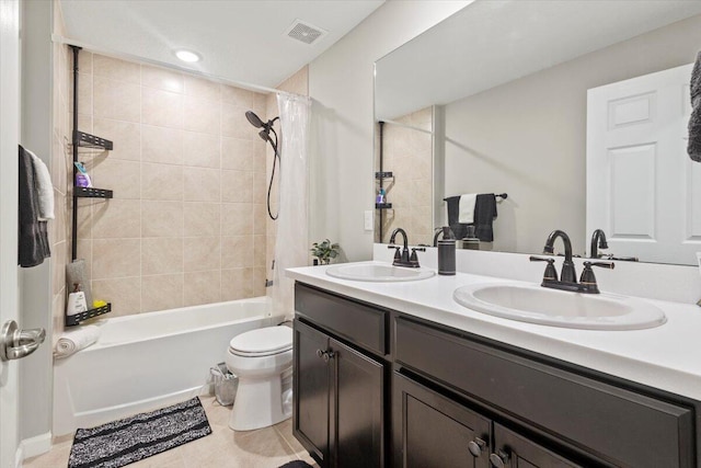 full bathroom with vanity, shower / bath combination with curtain, toilet, and tile patterned floors