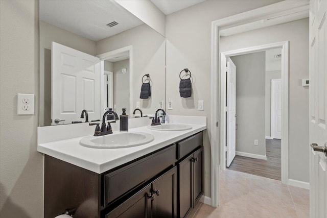 bathroom featuring vanity and hardwood / wood-style flooring