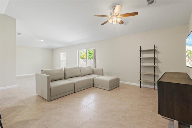 living room with ceiling fan and light tile patterned flooring