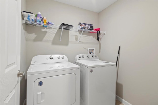 clothes washing area with independent washer and dryer