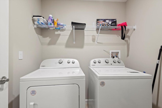 washroom with washing machine and dryer