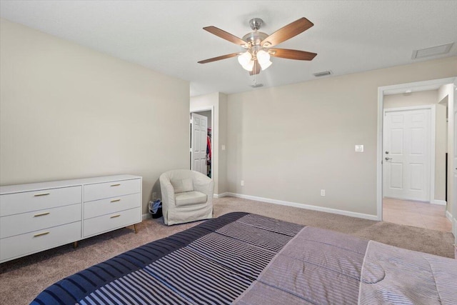 bedroom featuring ceiling fan and light carpet