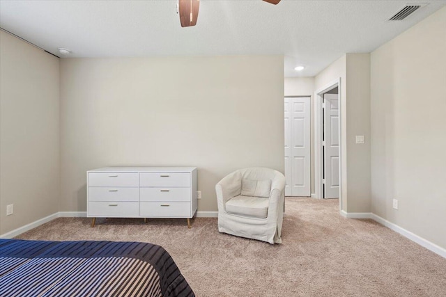 bedroom with light carpet and ceiling fan