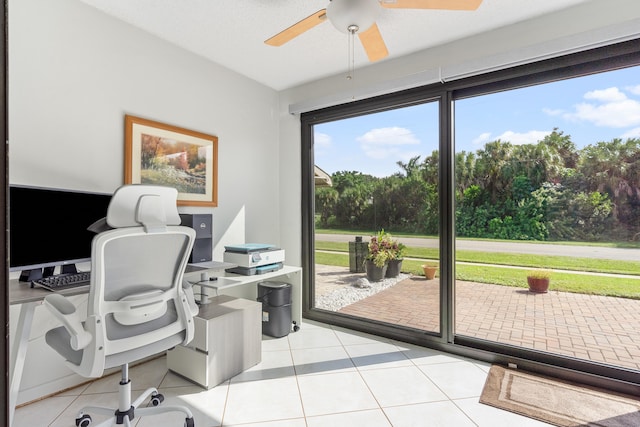 home office featuring ceiling fan and light tile patterned floors