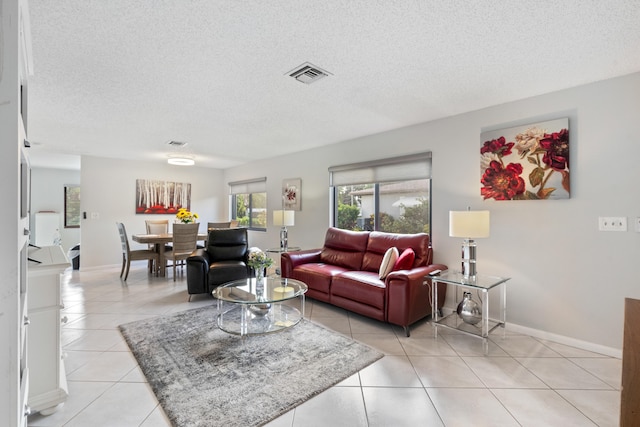 tiled living room with a textured ceiling