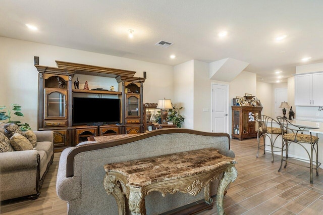 living room with light hardwood / wood-style flooring