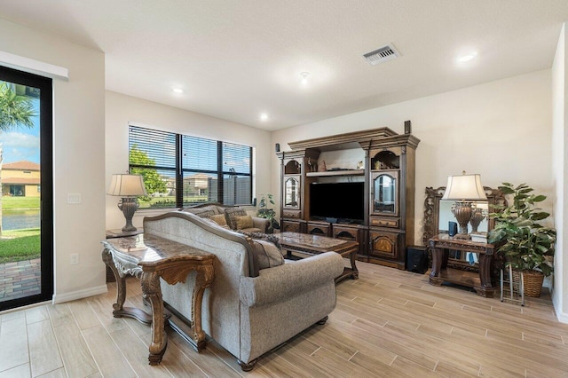 living room with light hardwood / wood-style floors