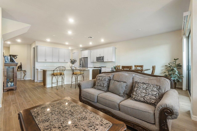 living room with light hardwood / wood-style floors