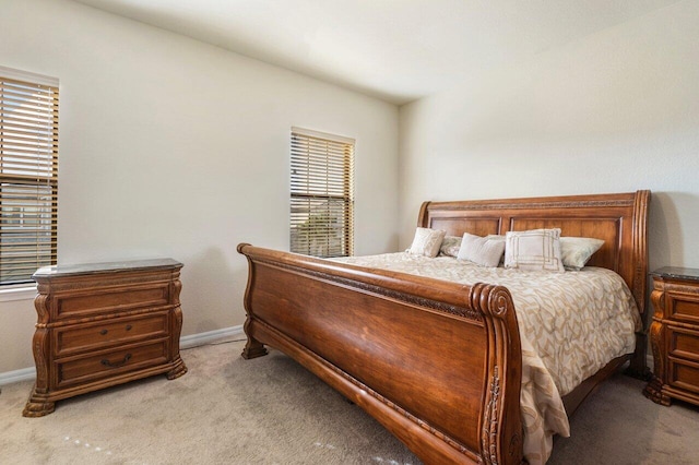 bedroom featuring light carpet