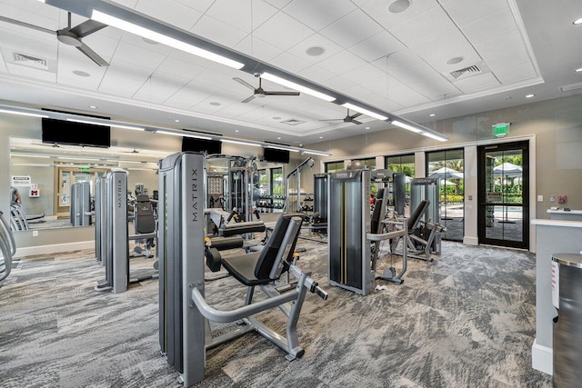 gym featuring french doors, carpet floors, a tray ceiling, and ceiling fan