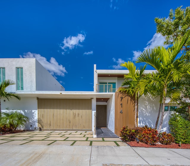 doorway to property featuring a carport