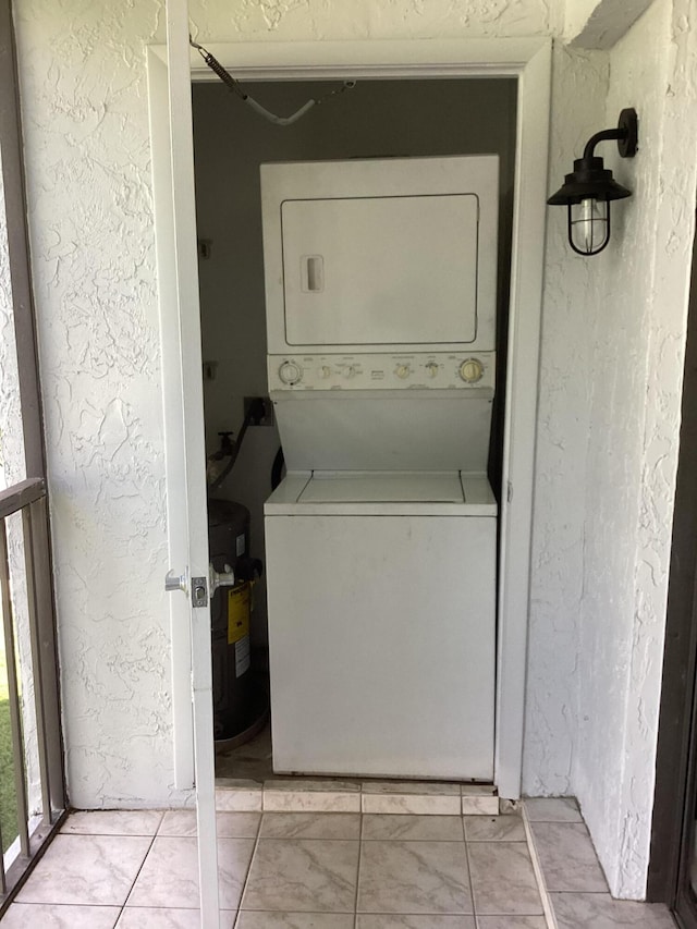 washroom with stacked washer / drying machine