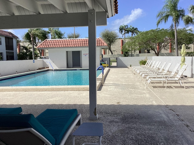 view of swimming pool featuring a patio area