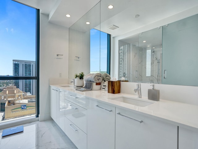 bathroom with vanity and an enclosed shower