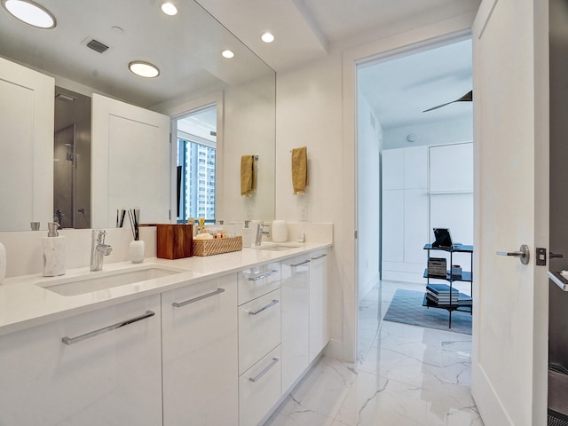 bathroom featuring vanity and a shower