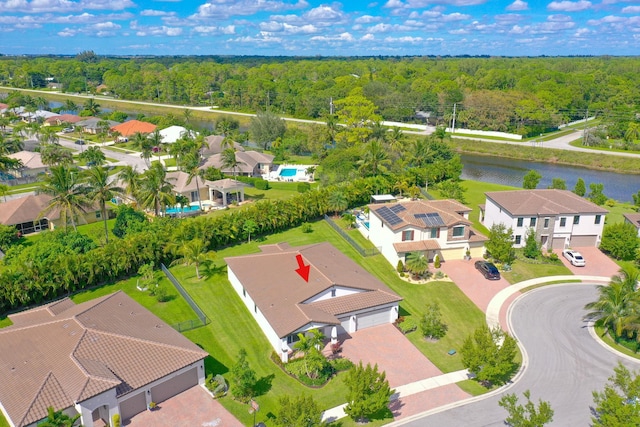 birds eye view of property with a water view