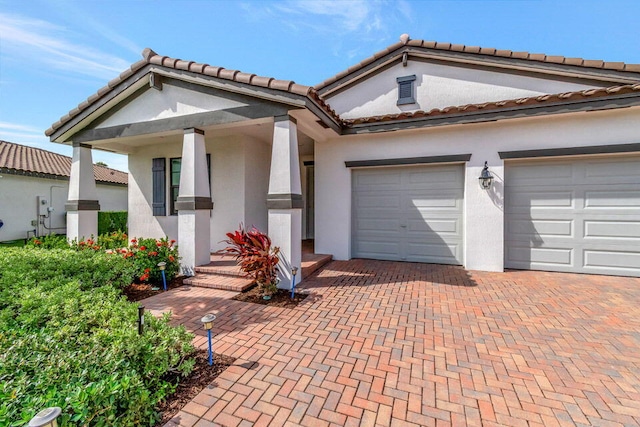 view of front of house with a porch and a garage