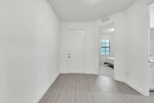 unfurnished room featuring light wood-type flooring