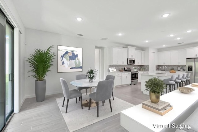 dining room featuring light hardwood / wood-style floors