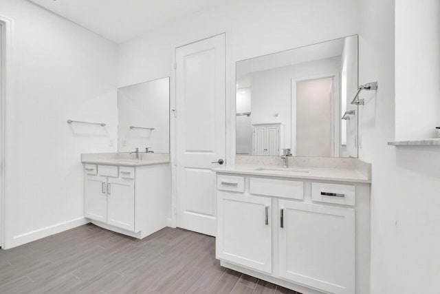 bathroom featuring hardwood / wood-style floors and vanity