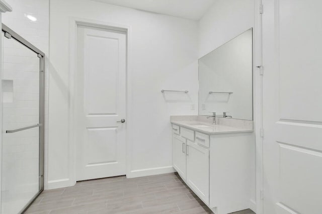 bathroom with vanity and walk in shower