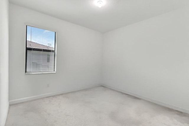 empty room featuring light colored carpet