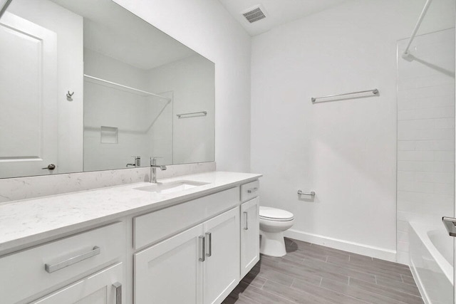 full bathroom with hardwood / wood-style flooring, vanity, toilet, and bathing tub / shower combination