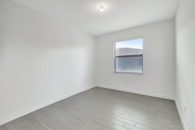 unfurnished room featuring light hardwood / wood-style floors