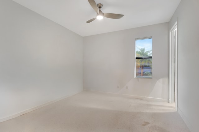 carpeted bedroom with connected bathroom and ceiling fan