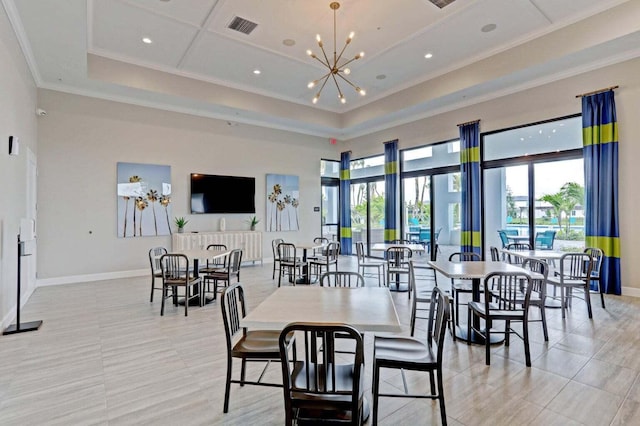 exercise room with a raised ceiling and crown molding