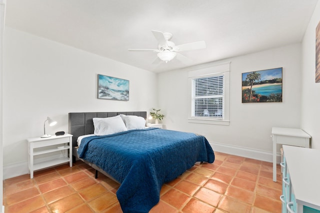 tiled bedroom with ceiling fan