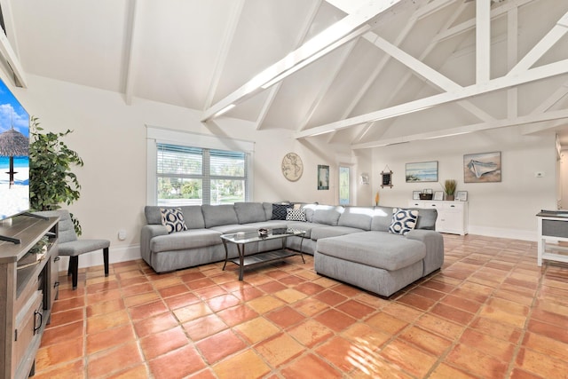 living room with high vaulted ceiling and beamed ceiling