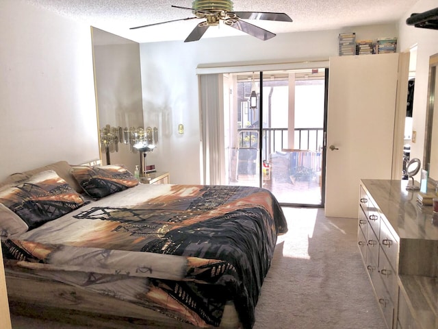 bedroom featuring access to exterior, light carpet, a textured ceiling, and a ceiling fan