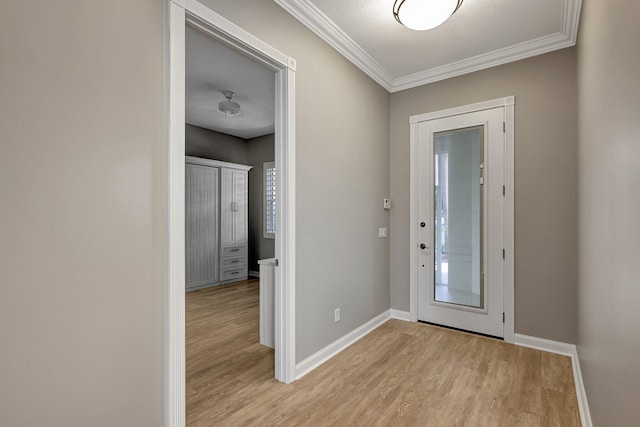 foyer featuring ornamental molding and light hardwood / wood-style floors