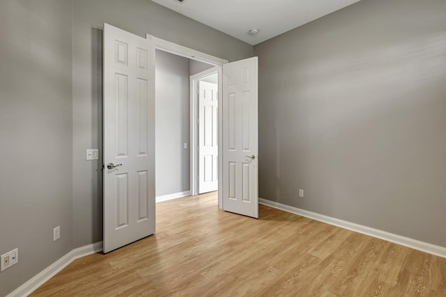 unfurnished bedroom featuring light hardwood / wood-style floors