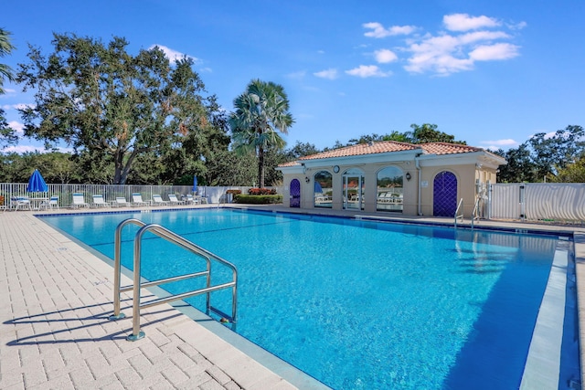 view of swimming pool with a patio